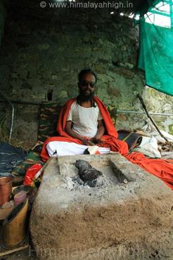 bangali maharaj posibng in front of his haven place
