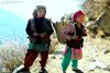 little girls on daily duty in the mountains