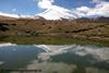reflection of kang yatse in a lake towards nimaling